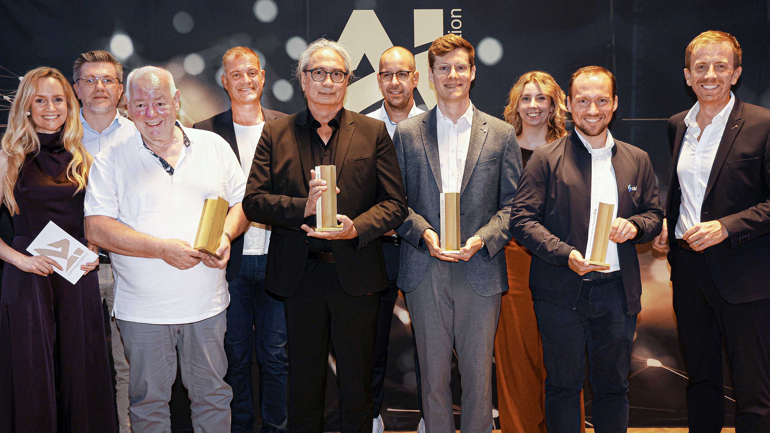 Gewinner 2026 mit Jury-Mitgliedern Gewinner AI Communication Award 2026 mit einigen Jury-Mitgliedern